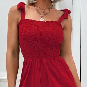 Women’s red romper new with tags and never been worn.